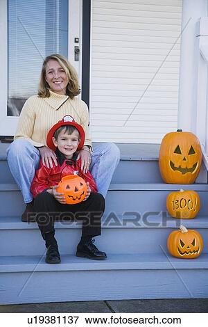 Mother and son dressed in fireman Halloween costume View Large Photo Image Stock Photo - Mother and son dressed in fireman Halloween costume. Fotosearch