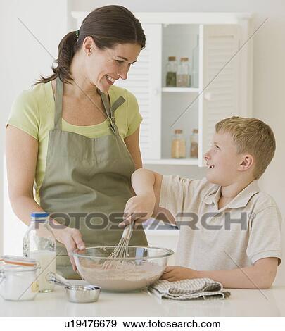 Mother and son making batter View Large Photo Image Stock Photo - Mother and son making batter. Fotosearch