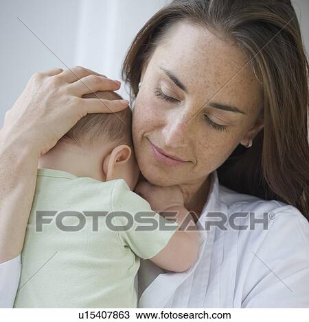 Mother holding baby son View Large Photo Image Stock Image - Mother holding baby son. Fotosearch