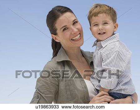 Mother holding son View Large Photo Image Stock Image - Mother holding son. Fotosearch