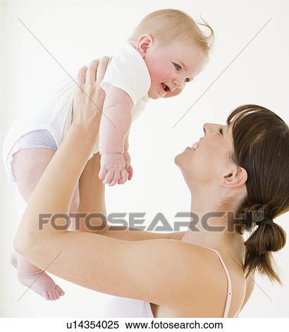 Mother smiling at baby View Large Photo Image Stock Photography - Mother smiling at baby. Fotosearch