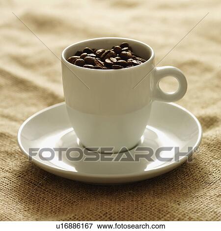 Mug filled with coffee beans View Large Photo Image Stock Photo - Mug filled with coffee beans. Fotosearch