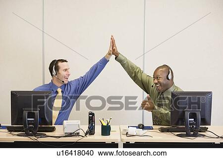 Multi-ethnic businessmen high-fiving View Large Photo Image Stock Image - Multi-ethnic businessmen high-fiving. Fotosearch