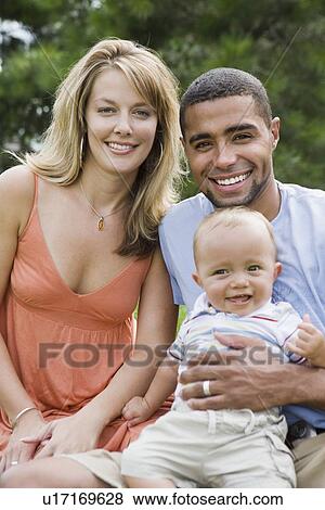 Stock Photo - Multi-ethnic family with baby. Fotosearch