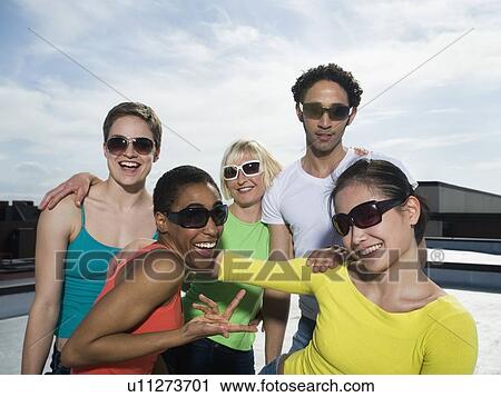 Multi-ethnic friends wearing sunglasses View Large Photo Image Stock Image - Multi-ethnic friends wearing sunglasses. Fotosearch