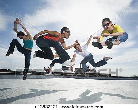Multi-ethnic group performing modern dance View Large Photo Image Stock Image - Multi-ethnic group performing modern dance. Fotosearch