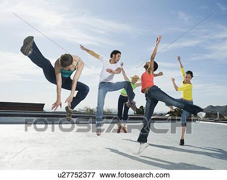 Multi-ethnic group performing modern dance View Large Photo Image Stock Photo - Multi-ethnic group performing modern dance. Fotosearch