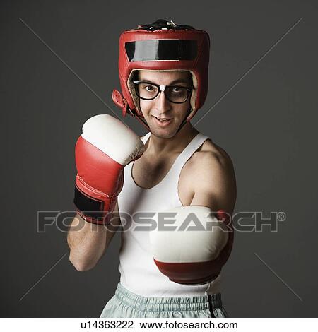 Nerdy man boxing View Large Photo Image Stock Image - Nerdy man boxing. Fotosearch