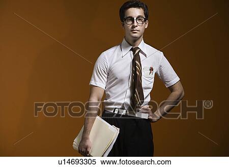 Nerdy man holding school books View Large Photo Image Stock Photography - Nerdy man holding school books. Fotosearch