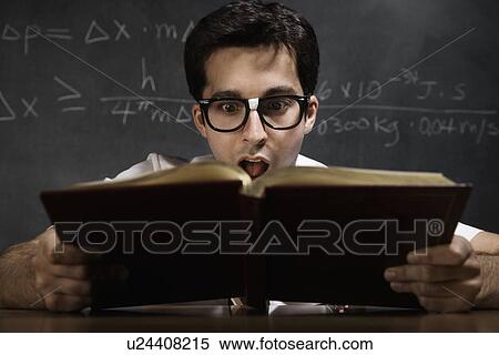 Nerdy man reading book View Large Photo Image Stock Photography - Nerdy man reading book. Fotosearch