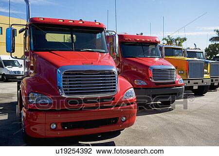 Stock Image - new trucks in a row. Fotosearch