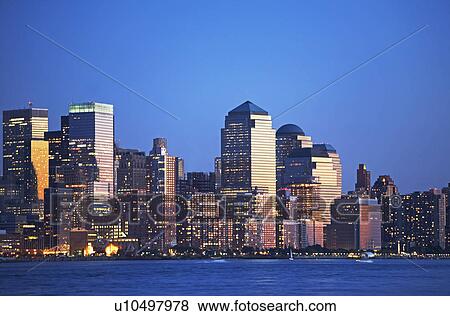 Stock Photo - New York City skyline along Hudson River at night, New York, United States. Fotosearch