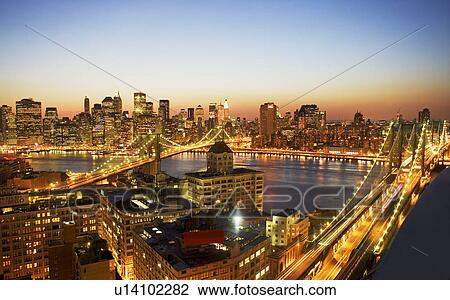 Stock Image - New York City skyline at dusk. Fotosearch