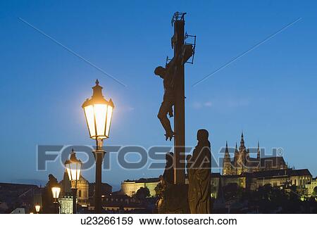 Night view of crucifix and cathedral View Large Photo Image Stock Photo - Night view of crucifix and cathedral. Fotosearch
