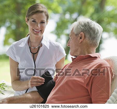 Nurse checking senior man’s blood pressure View Large Photo Image Stock Photography - Nurse checking senior man’s blood pressure. Fotosearch