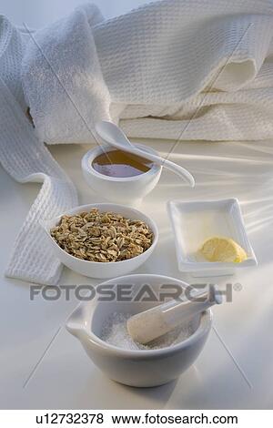 Stock Photo - Oatmeal, honey, and lemon spa facial treatment. Fotosearch