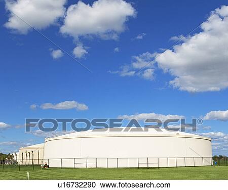 Oil refinery storage under blue sky View Large Photo Image Stock Image - Oil refinery storage under blue sky. Fotosearch