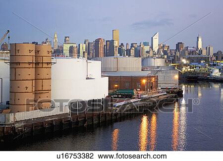 Oil storage tanks with New York City in background View Large Photo Image Stock Image - Oil storage tanks with New York City in background. Fotosearch