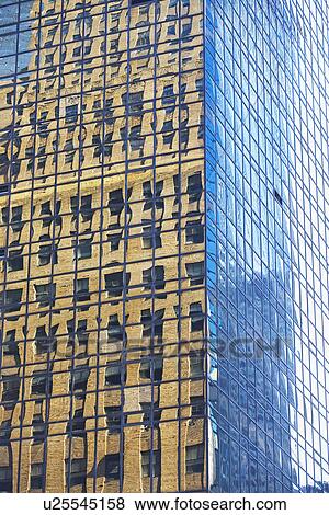 Old building reflected in modern building windows View Large Photo Image Stock Photo - Old building reflected in modern building windows. Fotosearch