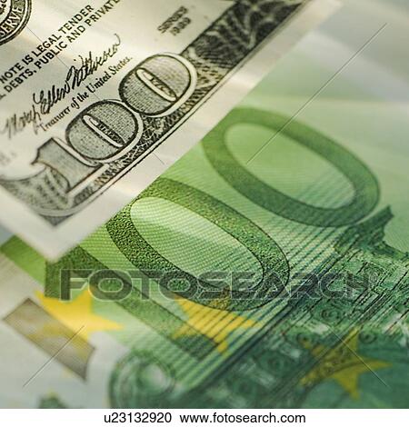 Stock Image - One hundred dollar bill and one hundred euro bill. Fotosearch