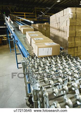 Packages on conveyor belt in warehouse View Large Photo Image Stock Photography - Packages on conveyor belt in warehouse. Fotosearch