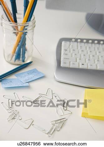 Stock Photograph - Paperclips in shape of heart. Fotosearch