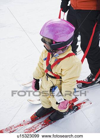 Parent and child skiing View Large Photo Image Stock Photo - Parent and child skiing. Fotosearch