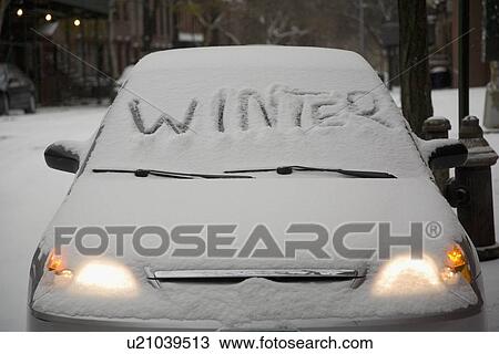 Stock Image - Parked car covered in snow. Fotosearch