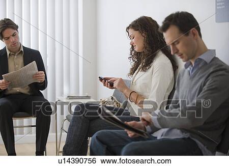 Stock Photograph - Patients sitting in waiting room. Fotosearch