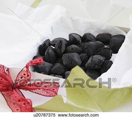 Pile of coal in gift box View Large Photo Image Stock Photography - Pile of coal in gift box. Fotosearch
