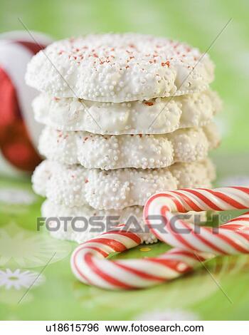 Stock Photograph - Pile of cookies next candy canes. Fotosearch