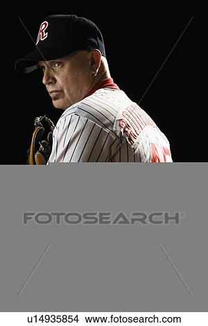 Pitcher holding baseball behind back View Large Photo Image Picture - Pitcher holding baseball behind back. Fotosearch