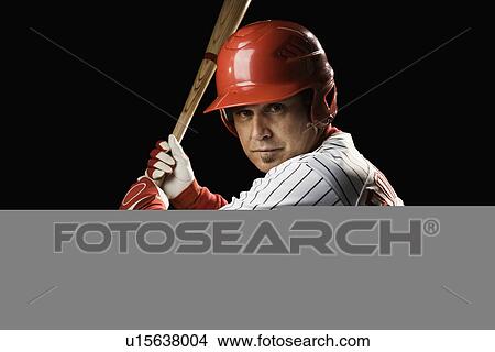 Picture - Portrait of batter holding baseball bat. Fotosearch