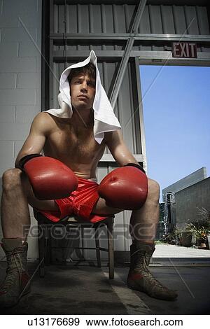 Portrait of boxer sitting on stool near doorway View Large Photo Image Stock Photo - Portrait of boxer sitting on stool near doorway. Fotosearch