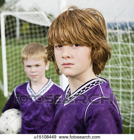Stock Photo - Portrait of boys in soccer uniforms. Fotosearch