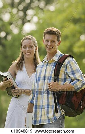 Portrait of college students with books and backpack View Large Photo Image Stock Photo - Portrait of college students with books and backpack. Fotosearch