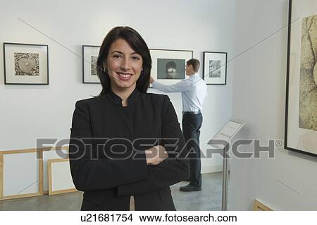 Picture - Portrait of curator in art gallery. Fotosearch