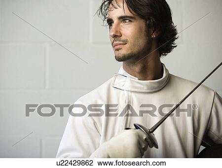 Portrait of fencer holding fencing foil View Large Photo Image Stock Image - Portrait of fencer holding fencing foil. Fotosearch