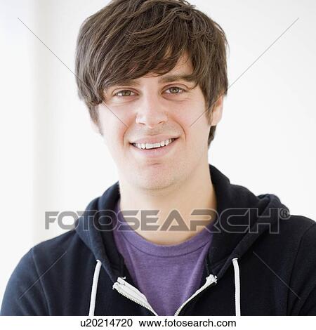 Stock Image - Portrait of man wearing sweatshirt. Fotosearch