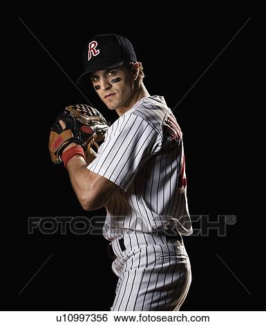Portrait of pitcher preparing to throw ball View Large Photo Image Stock Photograph - Portrait of pitcher preparing to throw ball. Fotosearch