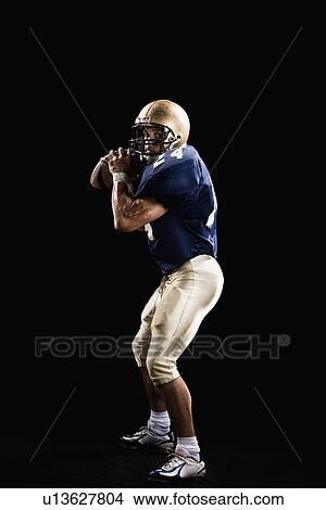Quarterback preparing to throw football View Large Photo Image Picture - Quarterback preparing to throw football. Fotosearch