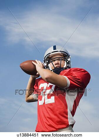 Quarterback preparing to throw football View Large Photo Image Stock Image - Quarterback preparing to throw football. Fotosearch