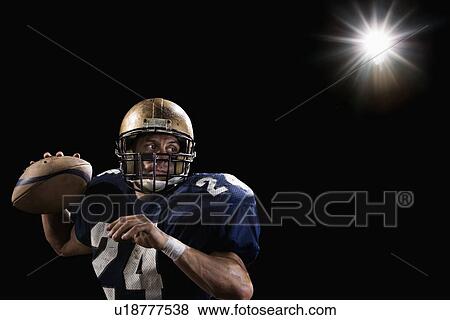 Stock Photo - Quarterback throwing football. Fotosearch
