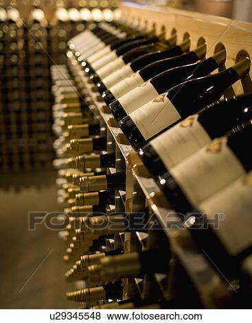 Racks of wine bottles View Large Photo Image Stock Photo - Racks of wine bottles. Fotosearch