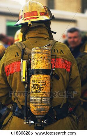 Rear view of fireman wearing oxygen tank View Large Photo Image Stock Photography - Rear view of fireman wearing oxygen tank. Fotosearch