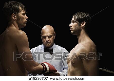 Stock Photo - Referee checking boxer’s gloves. Fotosearch