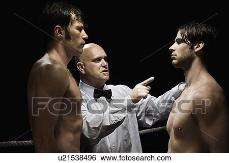 Stock Photograph - Referee standing between two boxers. Fotosearch