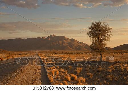 Stock Photo - Road and mountains, Namib Desert, Namibia, Africa. Fotosearch