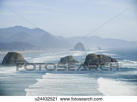 Stock Image - Rock formations in ocean. Fotosearch