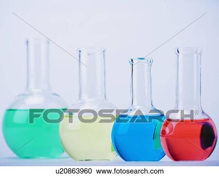 Stock Image - Row of beakers with liquid. Fotosearch